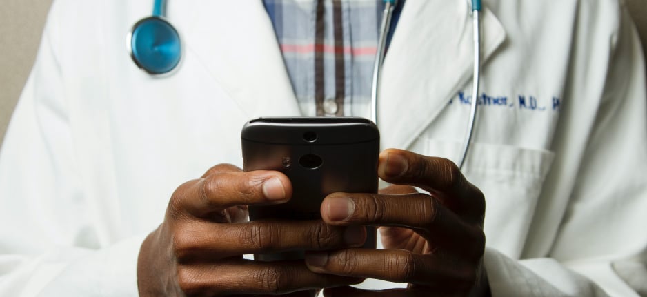 doctor holding a cell phone
