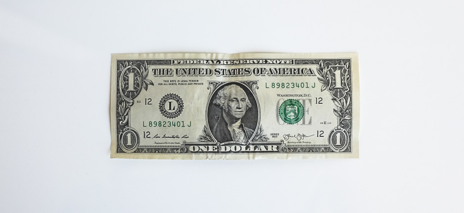 photo of dollar bill to discuss cannabis stocks